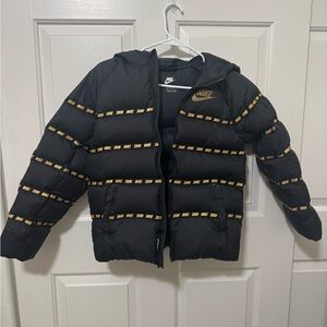 Nike Kids Puffer Jacket in Black with Gold Accents